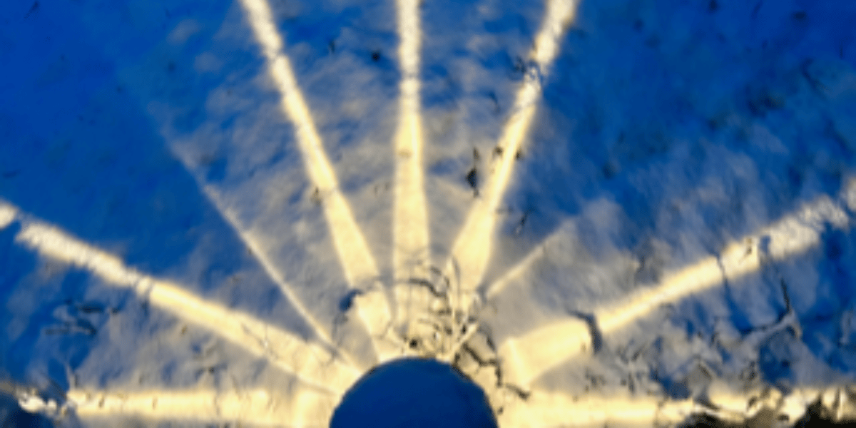 starburst of light on night snow